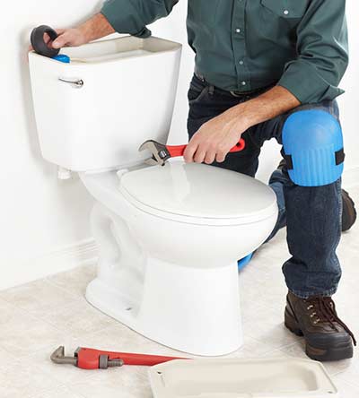 Vancouver plumber repair a toilet